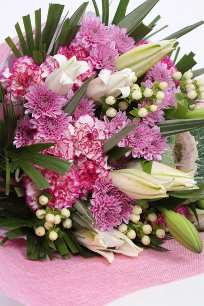 Hand Bunches Oriental Lily, Hypercium Berry, Carnations & Brassica