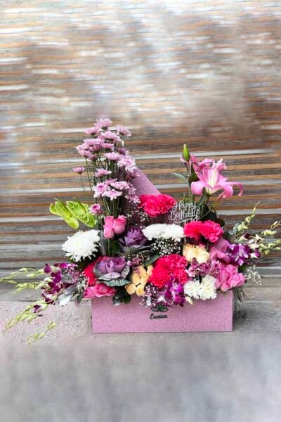 Box Arrangements Box flower arrangement of purple Daisy and Carnations