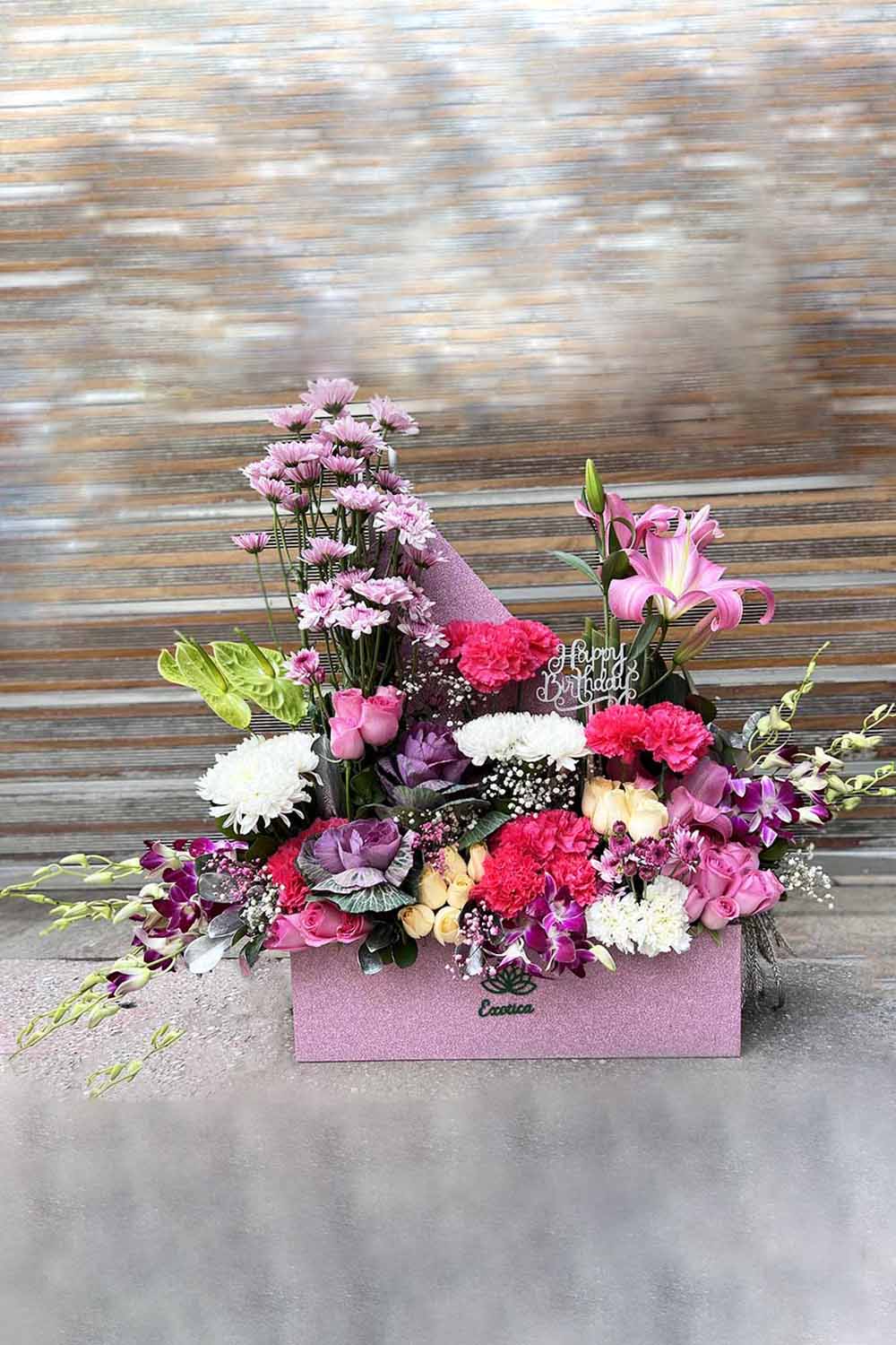 Buy Box flower arrangement of purple Daisy and Carnations Online at Low