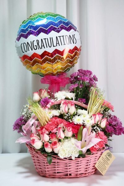 Basket Arrangements Flower Arrangement Of Jumilia Roses, Light Pink Carnation With Congratulation Balloon