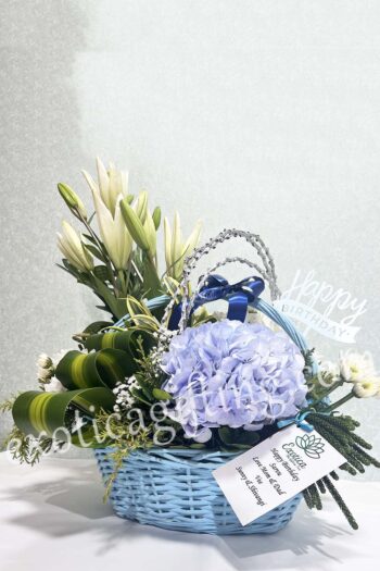 Basket Arrangements Flower Arrangement of Blue Hydrangea With Exotic Leaf