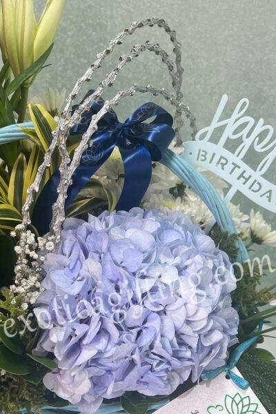 Basket Arrangements Flower Arrangement of Blue Hydrangea With Exotic Leaf