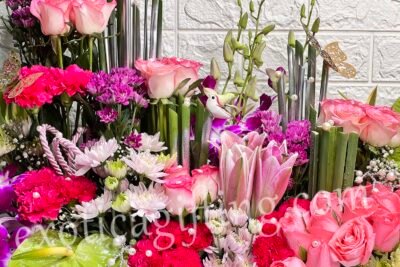 Box Arrangements Box Flower Arrangement of Light Pink Roses, Green Anthuirum With Purple Orchids.