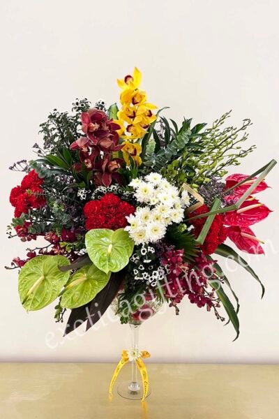Fresh Flowers Flower Arrangement of Red & Green  Anthurium & Red  Carnations With Red & Yellow Mokara .